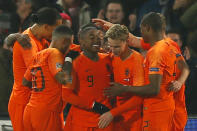 Netherlands players celebrate scoring 1-0 during the international friendly soccer match between The Netherlands and France at De Kuip stadium in Rotterdam, Netherlands, Friday, Nov. 16, 2018. (AP Photo/Peter Dejong)