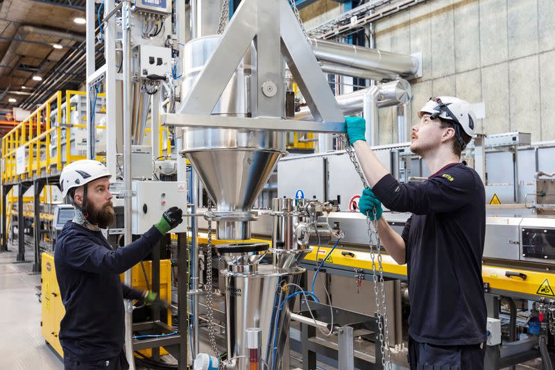 People work at a plant, owned by Talga Group, for processing graphite into anodes for electric vehicle batteries in Lulea