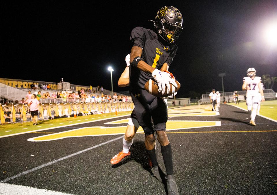 Charles "Tookie" Watts of the Bishop Verot High School football team catches a touchdown during a game against Estero High School at Bishop Verot on Friday, Oct. 27, 2023. Bishop Verot won 52-0.