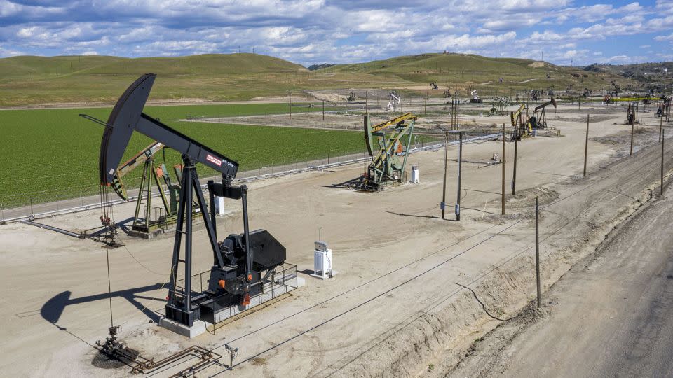 Oil well pump jacks operated by Chevron in San Ardo, California, in 2021. - David Paul Morris/Bloomberg/Getty Images