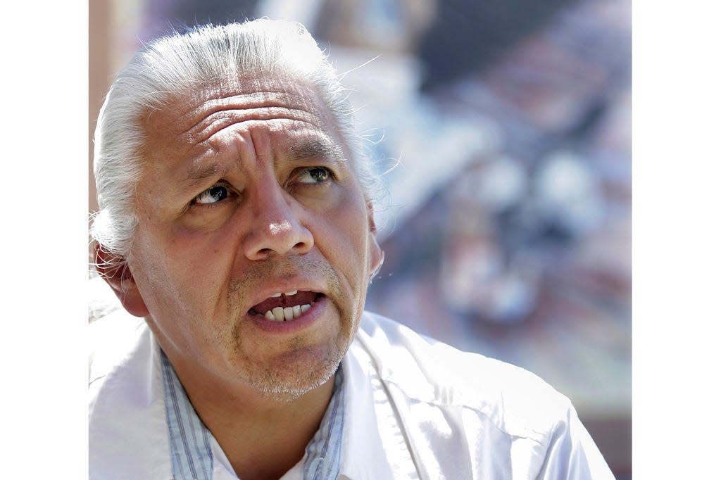 Joe A. Garcia, governor of northern New Mexico's Ohkay Owingeh pueblo, president of the National Congress of American Indians in Washington, D.C., and the chairman of the All Indian Pueblo Council, stands in front of a mural at the All Pueblo Cultural Center in Albuquerque, N.M., Friday, Aug., 11, 2006. Garcia's family says he has died on Thursday, May 11, at age 70. Based in New Mexico, he was an advocate for tribal sovereignty. Relatives confirmed Garcia died Thursday but did not give a cause of death. A traditional funeral already has been held.