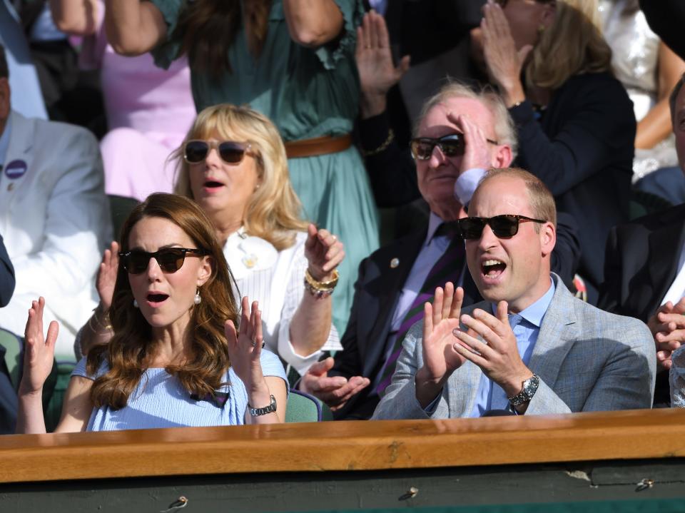 Kate Middleton and Prince William react to a match at Wimbledon in 2019.