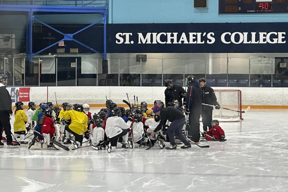 Players from around North America take part in the NHL All-Star Youth Hockey Jamboree Celebration at St. Michael's College School Arena in York, Ontario, Saturday, Feb. 3, 2024, during All-Star Weekend in Toronto. While Canada has seen a steep decline in children playing hockey in the sport's birthplace, the United States has experienced steady growth in that department over the past decade.(AP Photo/Stephen Whyno)