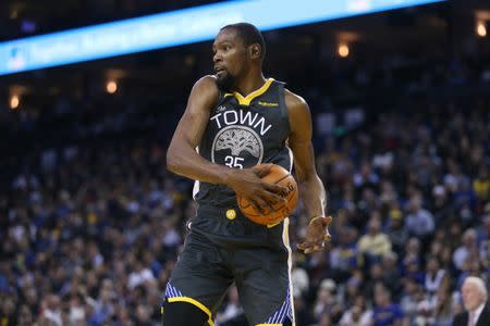 FILE PHOTO: Feb 6, 2019; Oakland, CA, USA; Golden State Warriors forward Kevin Durant (35) holds on to a rebound against the San Antonio Spurs in the third quarter at Oracle Arena. Mandatory Credit: Cary Edmondson-USA TODAY Sports