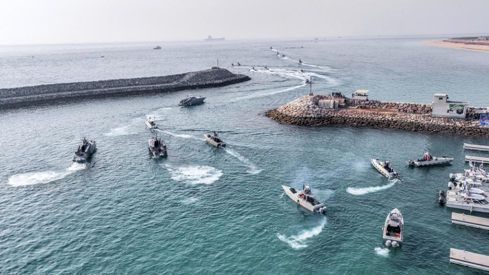 In this photo released Wednesday, Aug. 2, 2023, by Sepahnews of the Iranian Revolutionary Guard, the Guard's speedboats participate during a drill in the Persian Gulf. The U.S. military is considering putting armed personnel on commercial ships traveling through the Strait of Hormuz, in what would be an unheard of action aimed at stopping Iran from seizing and harassing civilian vessels, four American officials told The Associated Press on Thursday, Aug. 3, 2023. (Sepahnews via AP)
