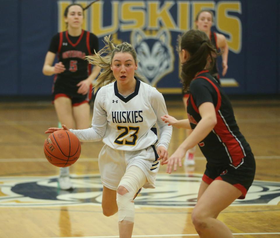 Highland's Logan VanZandt dribbles past Onteora's Riley Fitzgerald during the Section 9 Class B semifinal girls basketball game on February 27 2024.