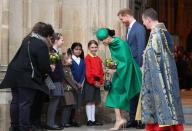 <p>Meghan and Prince Harry greet young schoolgirls.</p>