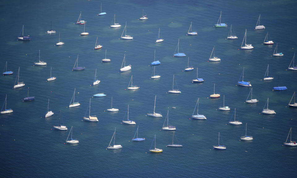 Sailing boats are anchored in Lake Bodensee in Konstanz, Germany, Friday, June 28, 2019. (Thomas Warnack//dpa via AP)