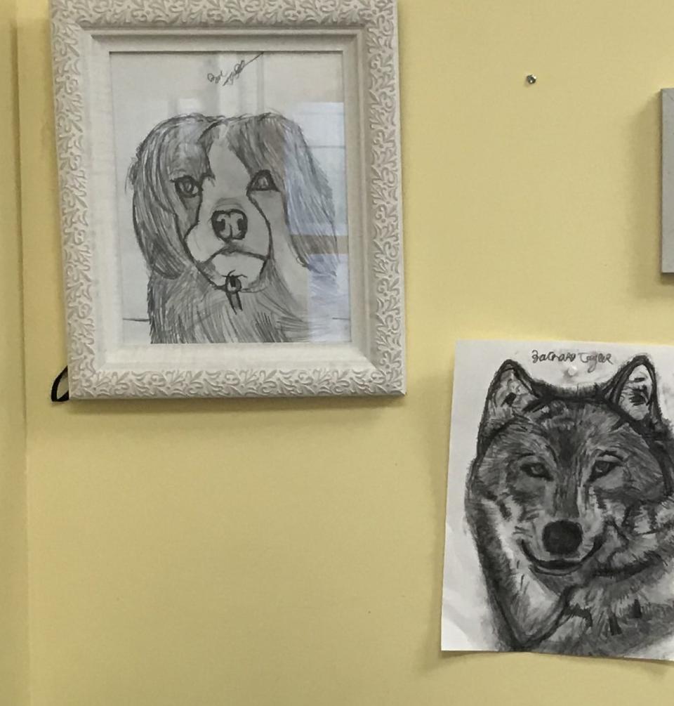 These drawings by Town Line Redemption Center of Dighton employee Zachary Taylor hand in Program Supervisor Kim Garrison's office, seen here on Wednesday, Feb. 8, 2023.