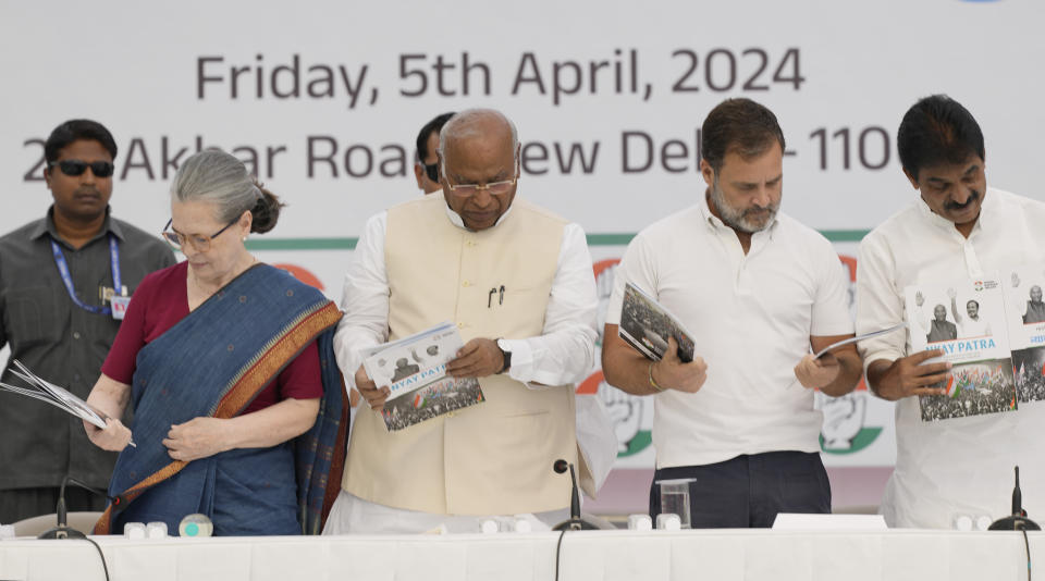 India’s opposition Congress party leaders from left, Sonia Gandhi, Mallikarjun Kharge, Rahul Gandhi and K.C.Venugopal look at copies of party’s election manifesto during a press conference in New Delhi, India, Friday, April 5, 2024. India's 6-week-long general election starts on April 19 and results will be announced on June 4. (AP Photo/Manish Swarup)