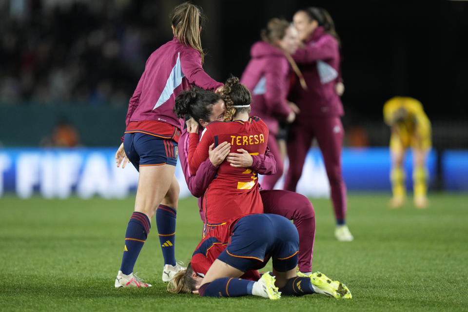 Spain's Teresa Abelleira celebrates with teammates after winning the Women's World Cup semifinal soccer match between Sweden and Spain at Eden Park in Auckland, New Zealand, Tuesday, Aug. 15, 2023. (AP Photo/Alessandra Tarantino)