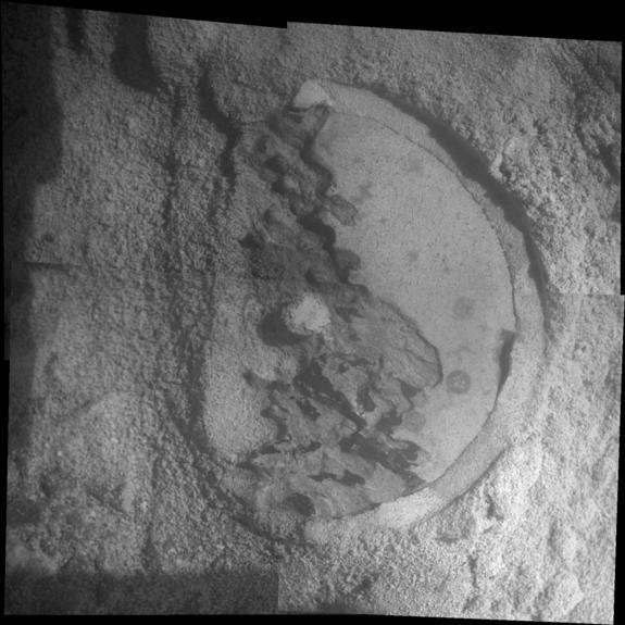 This mosaic of four frames shot by the microscopic imager on the robotic arm of NASA's Mars Exploration Rover Opportunity shows a rock target called "Esperance" after some of the rock's surface had been removed by Opportunity's rock abrasion to