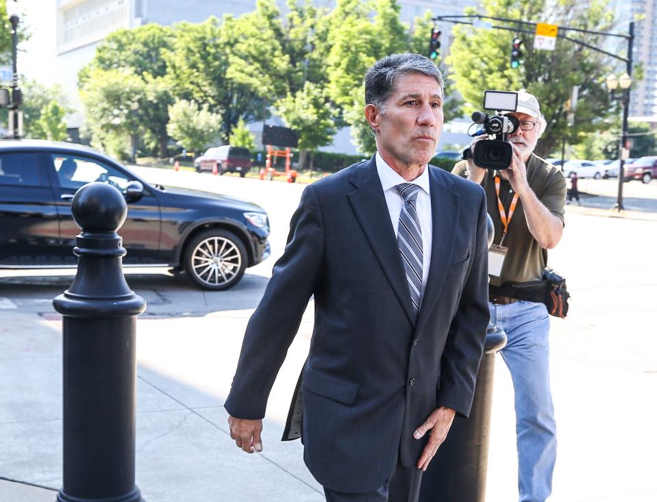 Former assistant coach Dino Gaudio walks towards the Gene Snyder Federal Courthouse on Broadway in Louisville Friday morning, Gaudio would enter a guilty plea to his UofL extortion case. His sentencing is Aug. 27 June 4, 2021