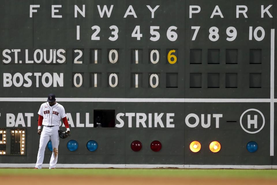 Boston Red Sox's Franchy Cordero stands in front of the scoreboard during the sixth inning of a baseball game against the St. Louis Cardinals, Saturday, June 18, 2022, in Boston. (AP Photo/Michael Dwyer)