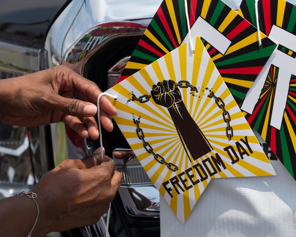 Florence Bell decorates her truck for the annual Galveston Juneteenth Parade in Galveston, Texas, on June 17.