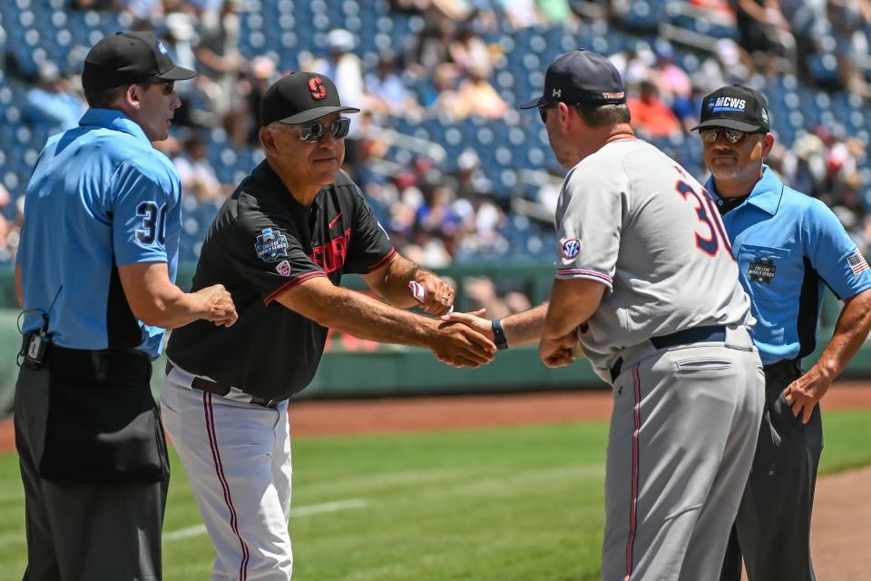 File photo - Stanford Cardinal head coach David Esquer and Auburn Tigers head coach Butch Thompson meet on June 20, 2022 before the game at Charles Schwab Field in Omaha, Nebraska.