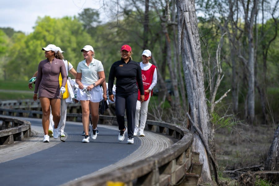 (L-R) Amari Avery of the United States, Bailey Shoemaker of the United States and Catherine Park of the United States walk to the No. 6 tee during a practice round prior to the Augusta National Women’s Amateur at Champions Retreat Golf Club, Tuesday, April 2, 2024.