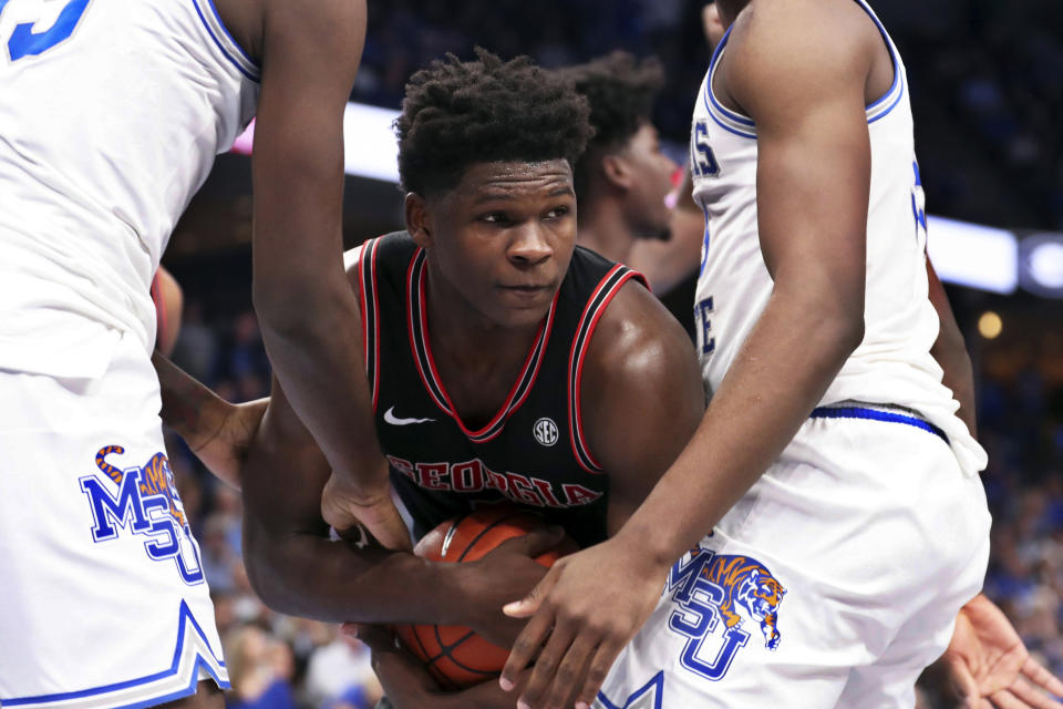 Georgia guard Anthony Edwards ( 5 ) grabs a rebound in the first half of an NCAA college basketball game against Memphis, Saturday, Jan. 4, 2020, in Memphis, Tenn. (AP Photo/Karen Pulfer Focht)