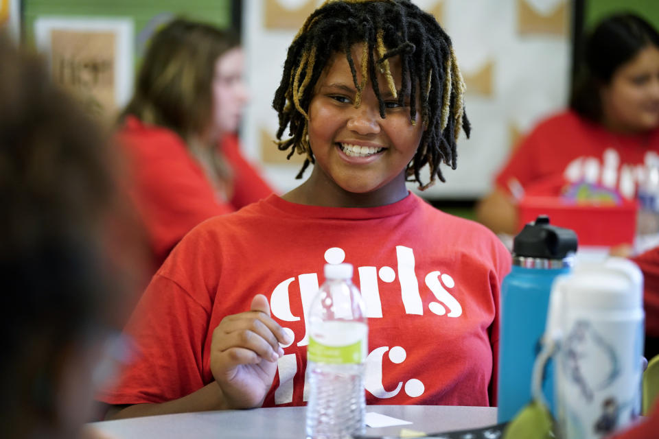 Lyrik, no last name given, smiles as she talks with classmates during a Lean In session at Girls Inc., Wednesday, July 26, 2023, in Sioux City, Iowa. Ten years after publishing her book “Lean In: Women, Work and the Will to Lead,” Sheryl Sandberg will launch a girls leadership program Thursday, July 27, through her foundation to respond to what she calls stubborn gender inequities. (AP Photo/Charlie Neibergall)