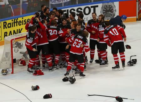 Canada's players celebrate defeating Russia in their Ice Hockey World Championship final game at the O2 arena in Prague, Czech Republic May 17, 2015. REUTERS/Laszlo Balogh