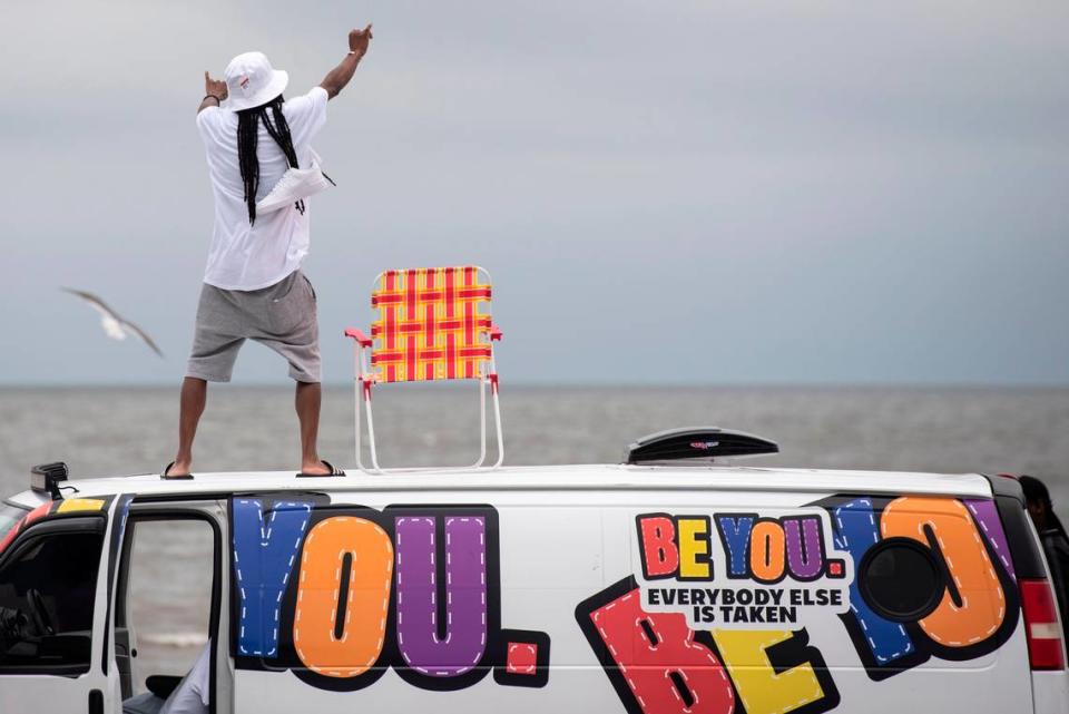 A spring breaker dances on top of a van during Black Spring Break at Biloxi Beach last year.