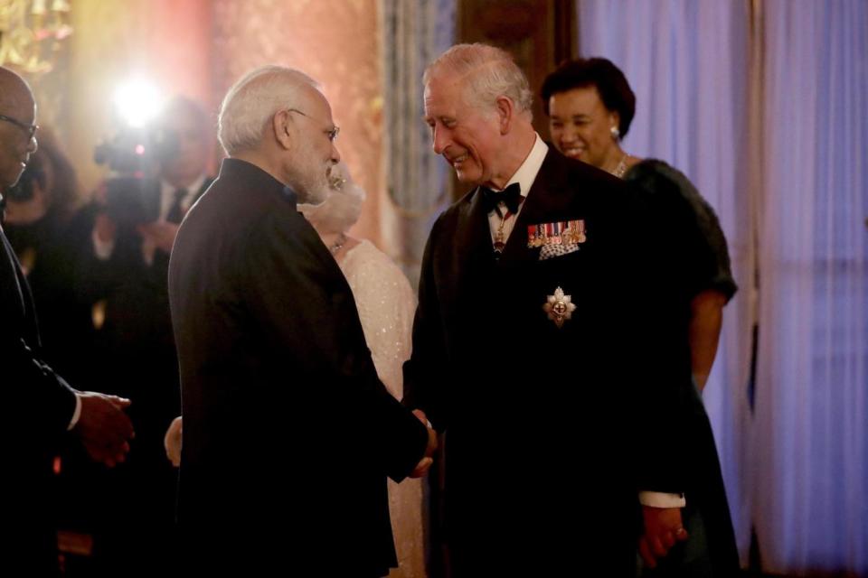 Prince Charles, right, greets India's Prime Narendra Modi at a Commonwealth dinner, has been chosen to take over the lead after his mother (AP)