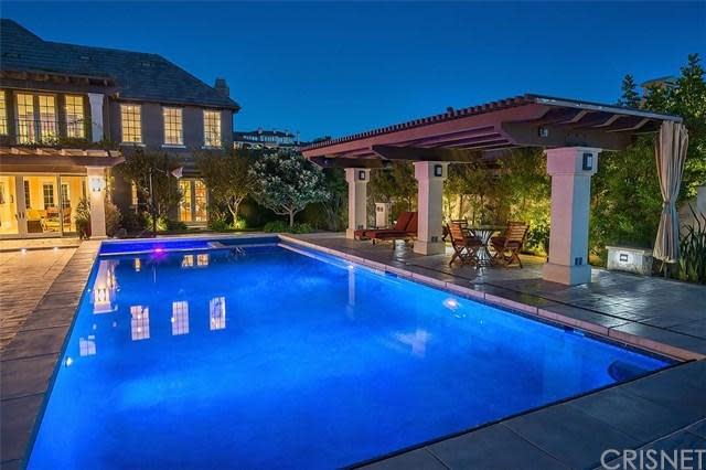 <p>The home boasts spectacular views of the surrounding mountains and city lights, which you can enjoy under the two verandas that flank the pool. (Trulia) </p>