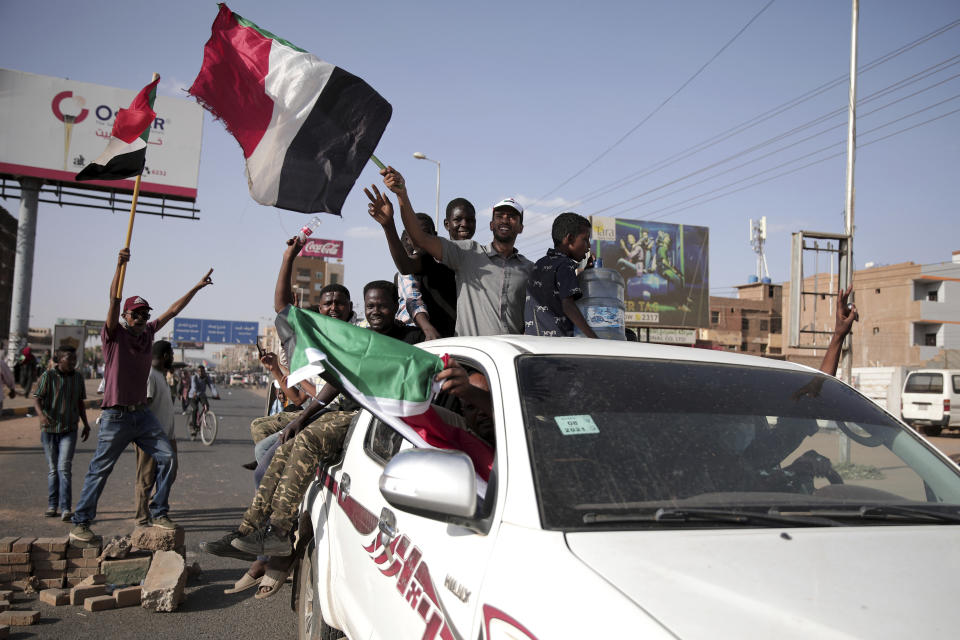 People chant slogans during a protest in Khartoum, Sudan, Saturday, Oct. 30, 2021. Pro-democracy groups called for mass protest marches across the country Saturday to press demands for re-instating a deposed transitional government and releasing senior political figures from detention. (AP Photo/Marwan Ali)