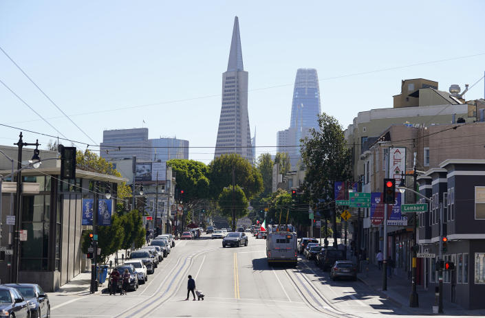 FILE - This Oct. 11, 2020, file photo shows the Transamerica Pyramid, center, and Salesforce Tower above Columbus Avenue in San Francisco. The Transamerica Pyramid, one of San Francisco's iconic buildings, has sold for $650 million, eight months after a sales agreement was reached. (AP Photo/Eric Risberg, File)