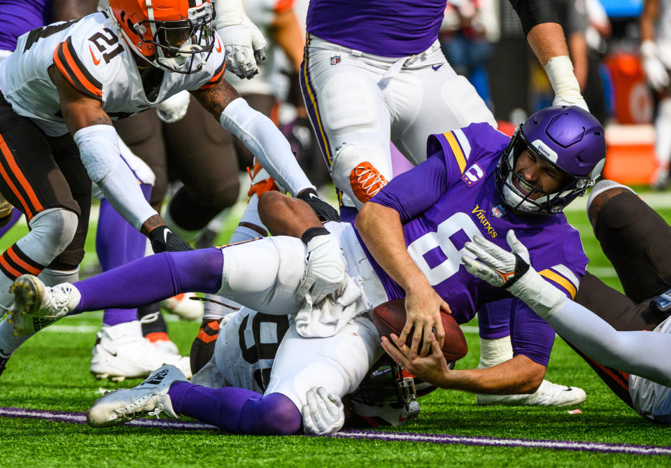 MINNEAPOLIS, MN - OCTOBER 03: Kirk Cousins #8 of the Minnesota Vikings is sacked with the ball by Myles Garrett #95 of the Cleveland Browns in the third quarter of the game at U.S. Bank Stadium on October 3, 2021 in Minneapolis, Minnesota. (Photo by Stephen Maturen/Getty Images)