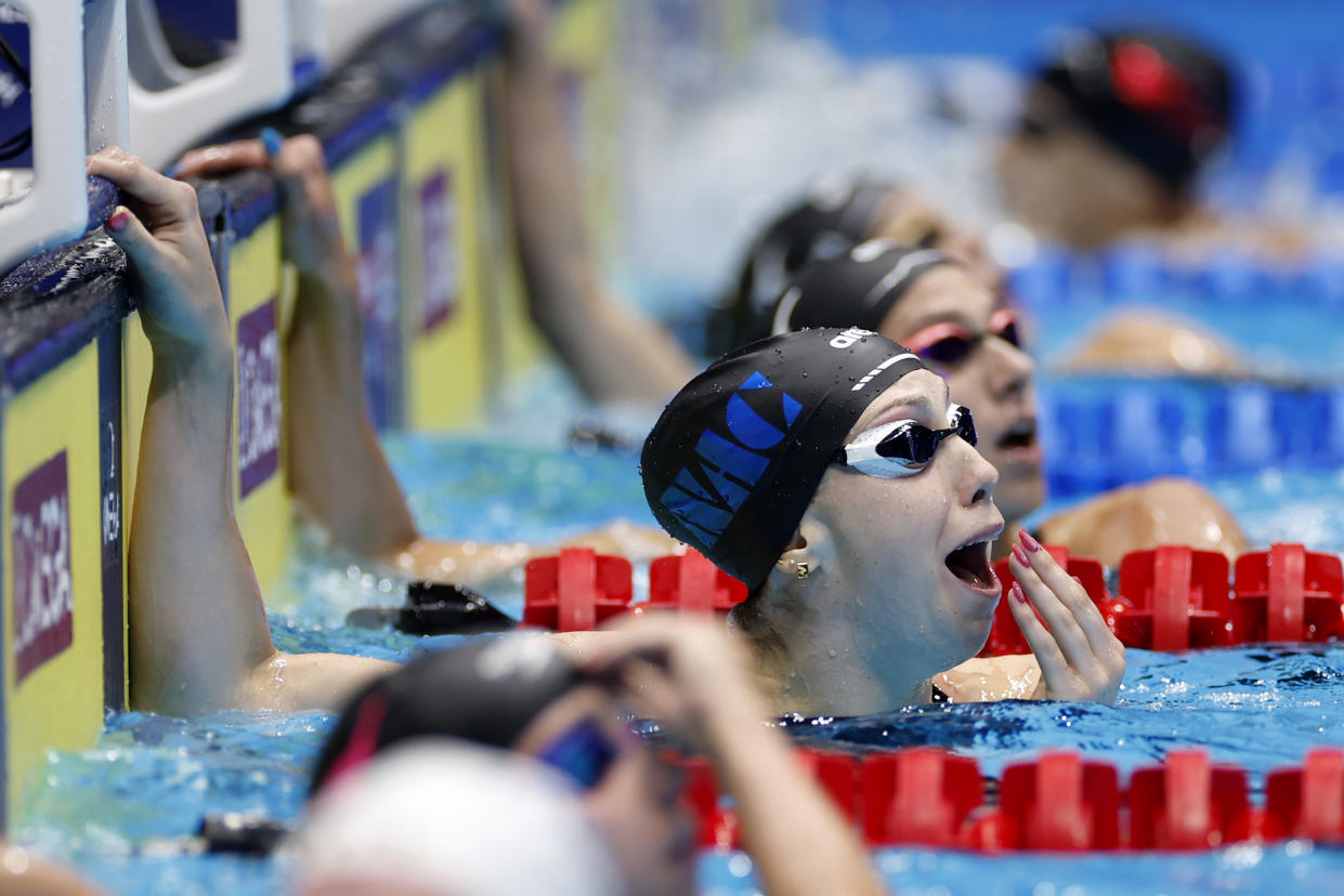 Walsh reacts after seeing her world-record-breaking time. (Sarah Stier/Getty Images)