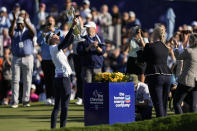 Nelly Korda, left, holds up the trophy after winning the Chevron Championship LPGA golf tournament Sunday, April 21, 2024, at The Club at Carlton Woods in The Woodlands, Texas. (AP Photo/Eric Gay)