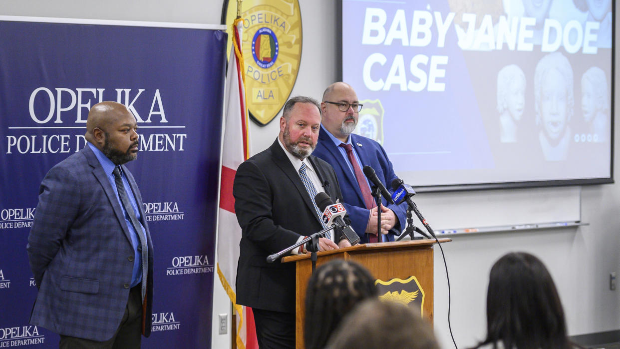 Opelika Police Chief Shane Healey, center, Sgt. Alfred White, left, and Capt. Johnathan Clifton address the media and community at a press conference at the Opelika Police Department Thursday, Jan. 19, in Opelika, Ala., regarding the 