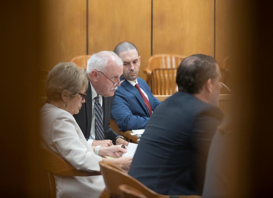 James Staley far right, is shown here in 89th District Court with defense attorneys Terri Moore, far left, and Mark G. Daniel, middle, on Tuesday, May 10, 2022.