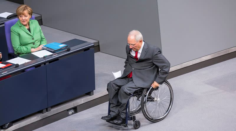 FILE PHOTO: FILE PHOTO: German Chancellor Merkel and Finance Minister Schaeuble attend a debate at the lower house of parliament Bundestag in Berlin
