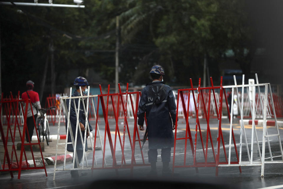 Police security forces stand guard at roadblocks leading to Martyrs' Mausoleum in Yangon, Myanmar Monday, July 19, 2021. Myanmar's military-installed government and those seeking to topple it on Monday marked the anniversary of the assassination of independence hero Gen. Aung San, who was also the father of the country's recently ousted leader, Aung San Suu Kyi. (AP Photo)