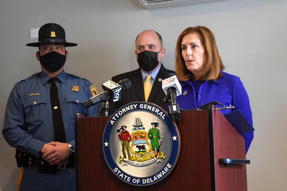 Delaware Attorney General Kathleen Jennings, flanked by Delaware State Police Maj. Pete Sawyer and ATF Agent John Oakey, holds a press conference at the Brick Hotel in Georgetown Feb. 16, 2022.