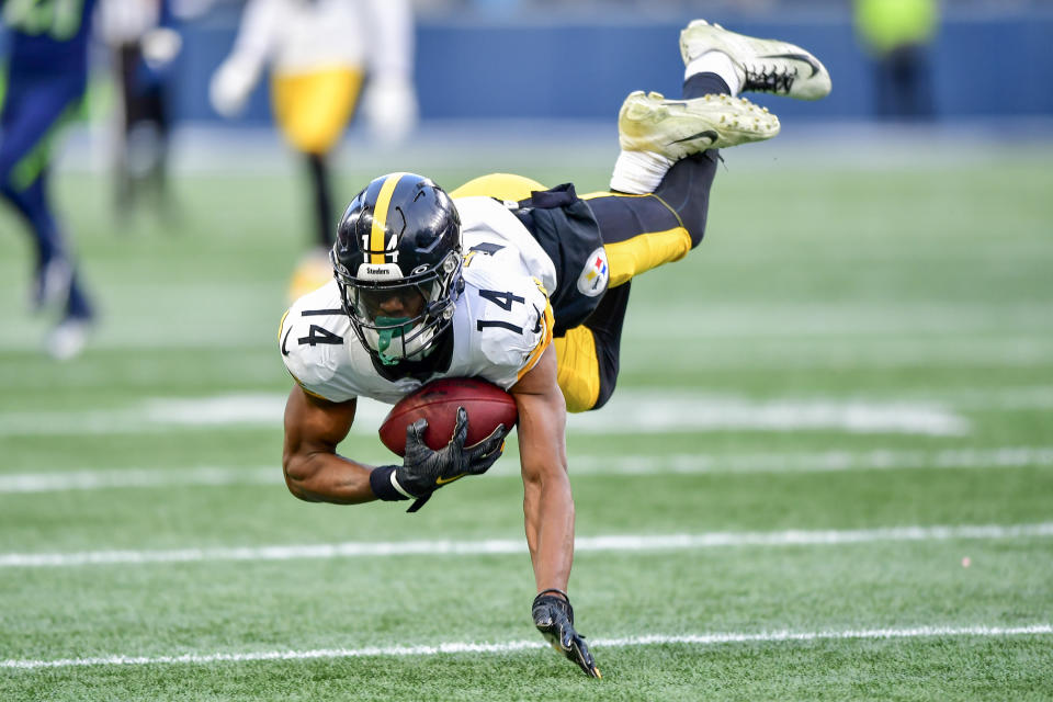 Steelers wide receiver George Pickens makes a tumbling catch against the Seahawks. (Photo by Jane Gershovich/Getty Images)