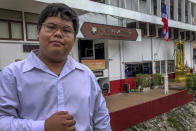 FILE - In this Oct. 16, 2020, file photo, activist Bunkueanun Paothong poses for a photo outside a police station in Bangkok, Thailand. The authorities in Thailand have filed the most severe charges yet in connection with ongoing pro-democracy student-led demonstrations, charging several men, including Paothong, under an article of the law covering violence against the queen. (AP Photo/Jerry Harmer, File)