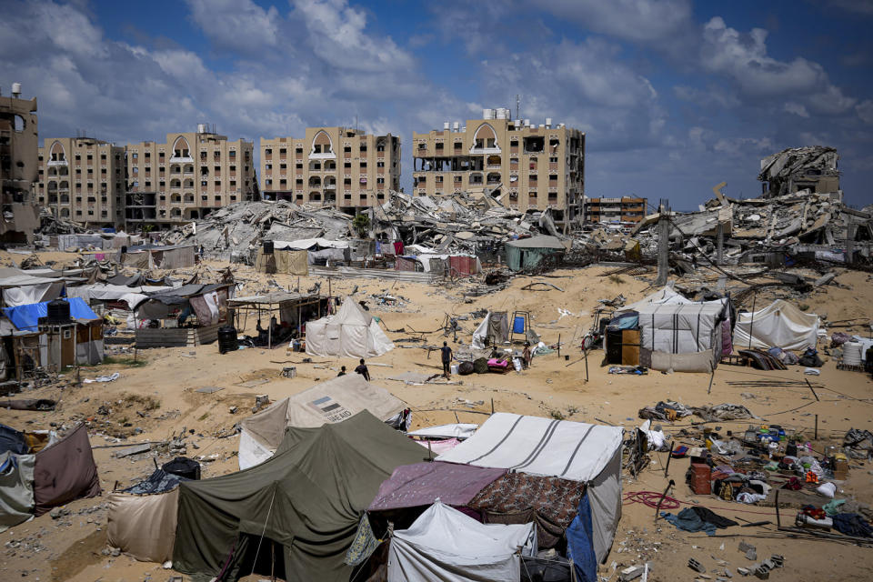 Palestinians displaced by the Israeli air and ground offensive on the Gaza Strip flee from Hamad City, following an evacuation order by the Israeli army to leave parts of the southern area of Khan Younis on Aug. 11, 2024. (Abdel Kareem Hana / AP)