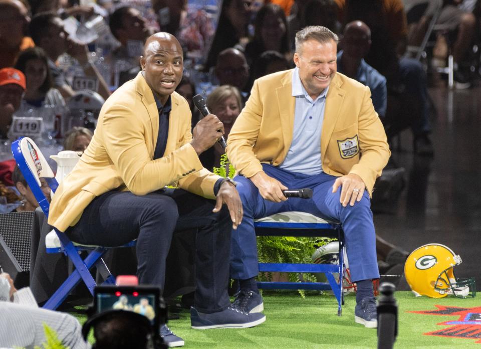 Class of 2023 Hall of Famers DeMarcus Ware (left) and Zach Thomas listen during the Enshrinees’ Roundtable.