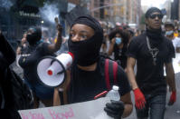 Protesters and activists move along 6th Avenue Saturday, June 6, 2020, in New York. Protests continued following the death of George Floyd, who died after being restrained by Minneapolis police officers on May 25. (AP Photo/Craig Ruttle)