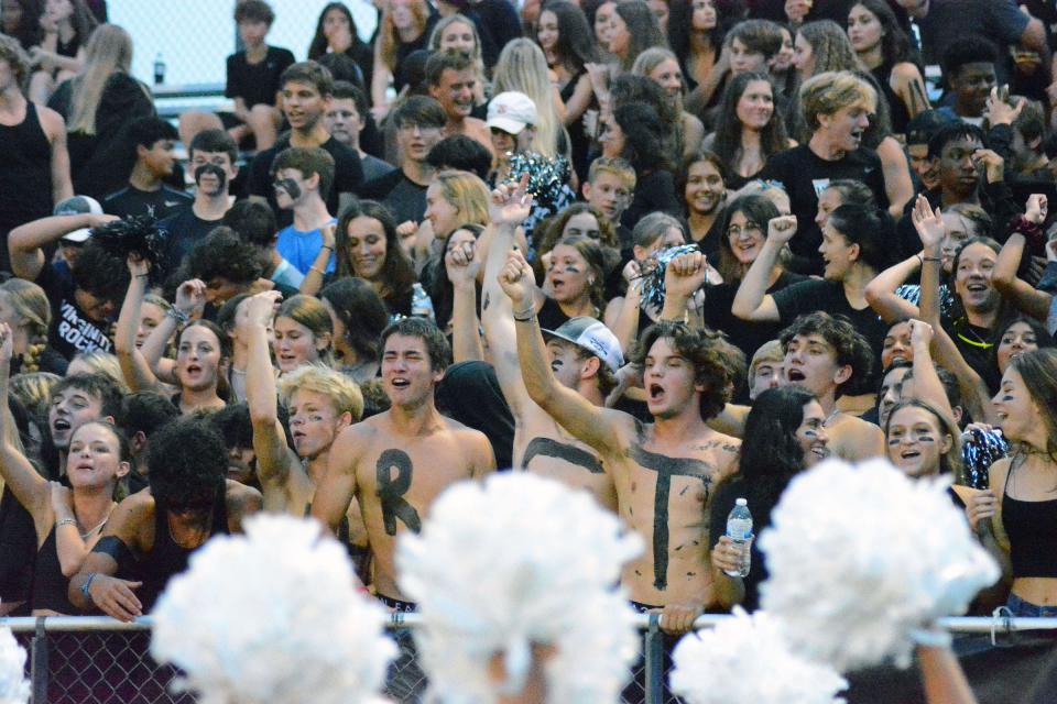 Richmond Hill fans in the student section cheer on their team at Friday night's game against Effingham County.