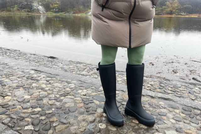 <p>People / Erika Reals</p> Senior shopping editor Erika Reals wears the Merry People Fergie rain boots on a wet walk through the park.