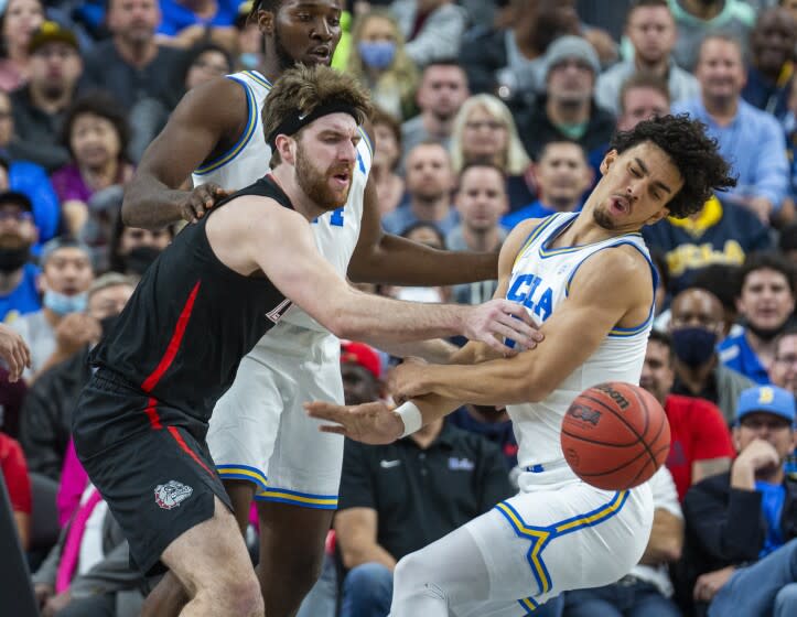 Gonzaga forward Drew Timme (2) loses the ball to UCLA guard Jules Bernard (1) during the first half of an NCAA college basketball game Tuesday, Nov. 23, 2021, in Las Vegas. (AP Photo/L.E. Baskow)