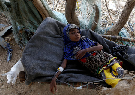 Afaf Hussein, 10, who is malnourished, lies inside a hut as she receives an injection near her family's house in the village of al-Jaraib, in the northwestern province of Hajjah, Yemen, February 20, 2019. Afaf, who now weighs around 11 kg and is described by her doctor as "skin and bones", has been left acutely malnourished by a limited diet during her growing years and suffering from hepatitis, likely caused by infected water. She left school two years ago because she got too weak. REUTERS/Khaled Abdullah