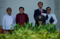 Indonesia's President Joko Widodo stands beside Vice President Jusuf Kalla with State Secretariat Minister Pratikno and Cabinet Secretary Pramono Anung while addressing the media during the announcement of the new cabinet at Presidential Palace in Jakarta, Indonesia, July 27, 2016. Antara Foto/Widodo S Jusuf/via REUTERS