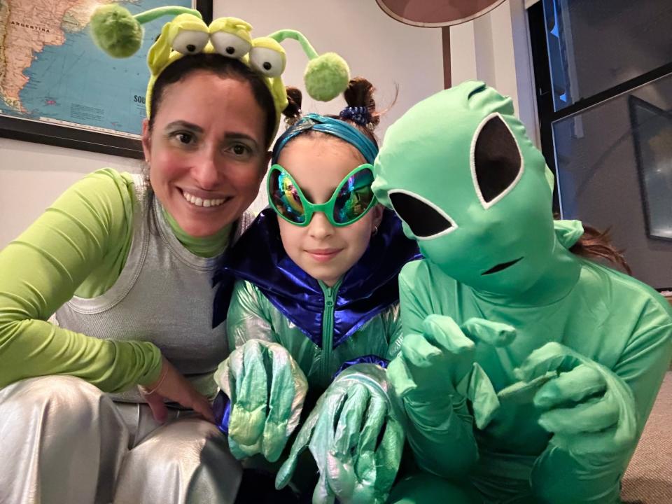 Grace Bastidas, editor-in-chief of Parents.com, with her children in their Martian costumes on Oct. 31, 2023.