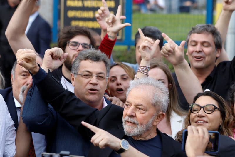 Former Brazilian President Luiz Inacio Lula da Silva gesture as he is released from prison, in Curitiba