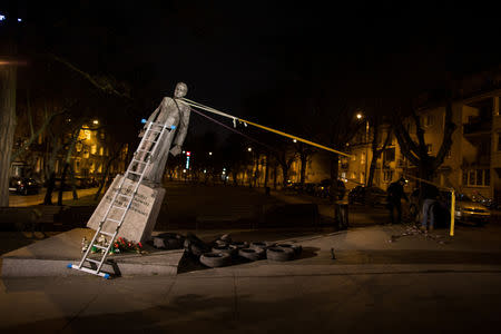 The monument of the late priest Henryk Jankowski is seen pulled down by activists in Gdansk, Poland February 21, 2019. Agencja Gazeta/Bartek Sabela via REUTERS